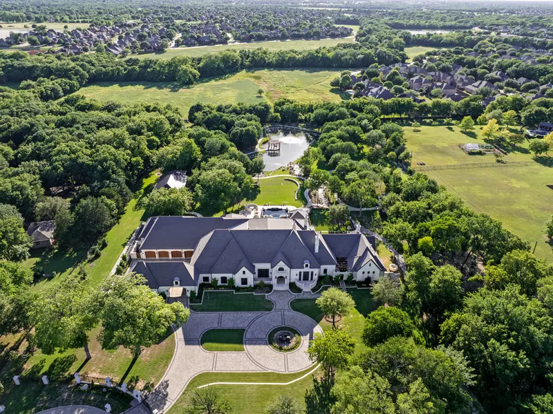 Aerial of the gated 6.4-acre grounds with half-acre pond and walking paths at Bella Terra Estate, Parker TX