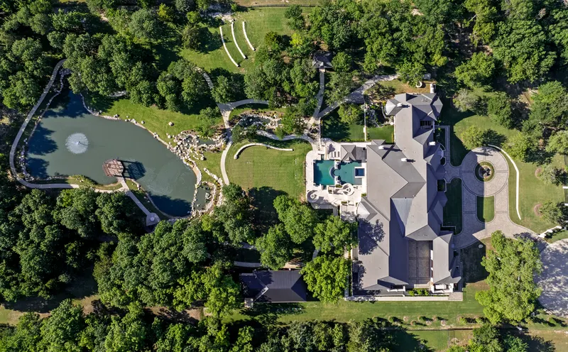Overhead aerial showing the pond, dock pergola, pool and circular drive at Bella Terra Estate, Parker TX