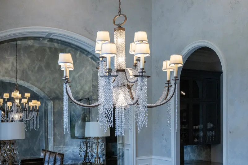 Crystal beaded chandelier above the formal dining room's plaster walls