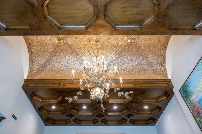 Library ceiling detail with coffered woodwork and hand-painted vaulted panels