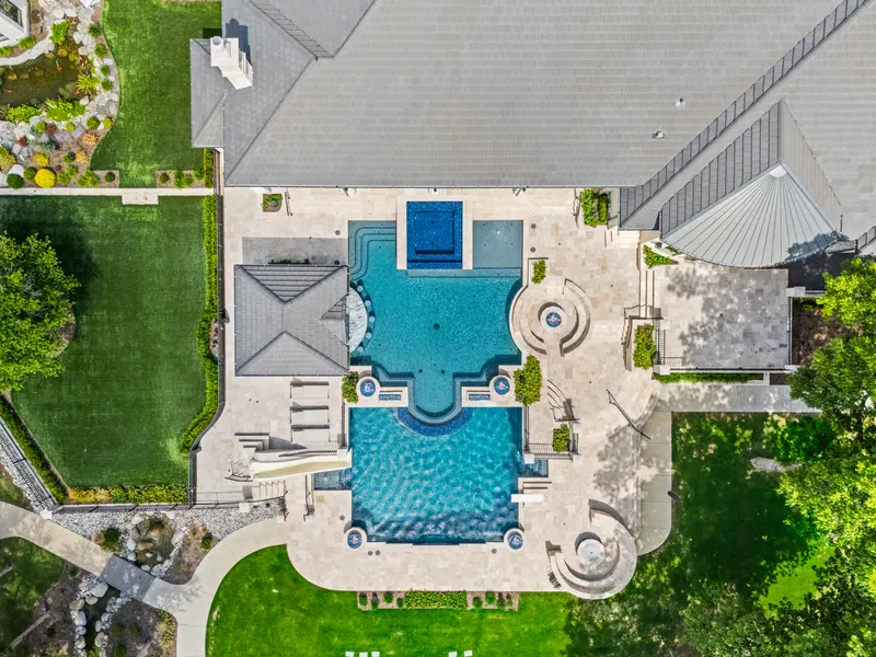 Overhead view of the two-level resort pool, slide and spa terraces at Bella Terra Estate, Parker TX